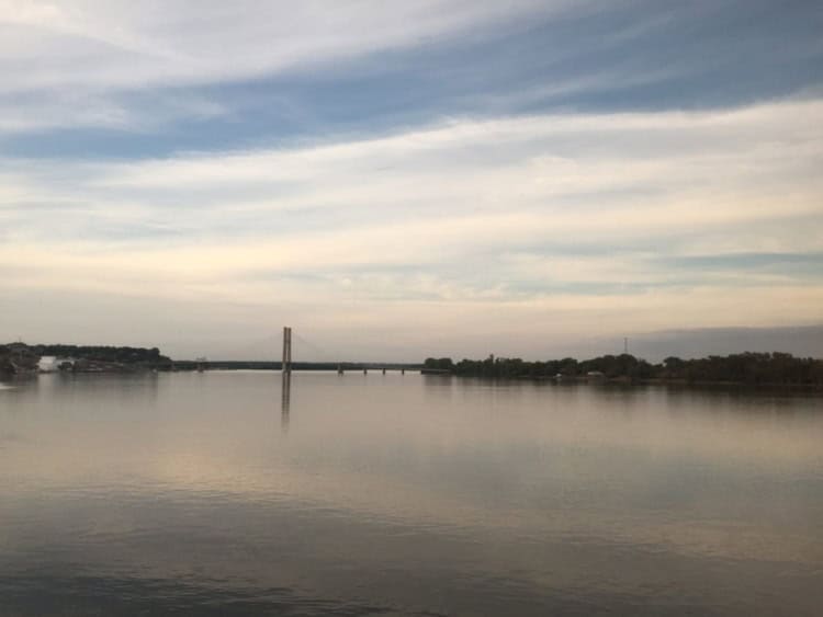 Amtrak Zephyr crossing the Mississippi River at sunset.