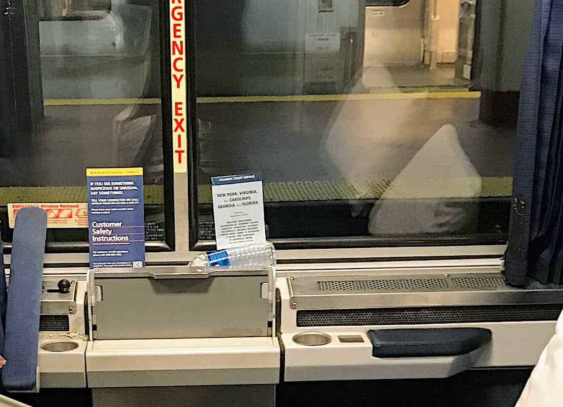 Amtrak Roomette with a timetable.