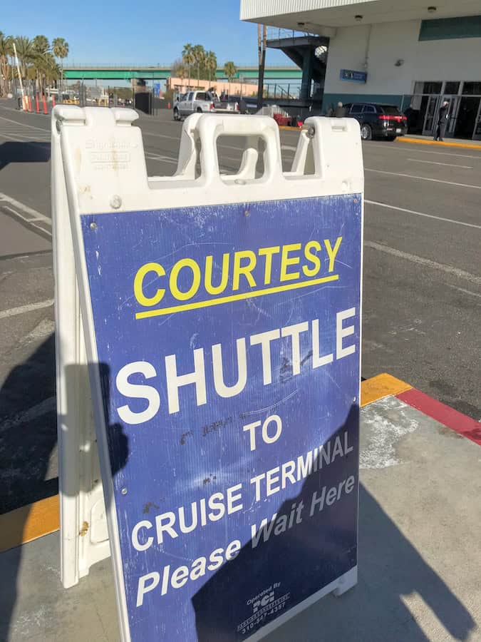 Shuttle bus sign at the San Pedro cruise port terminal exit.