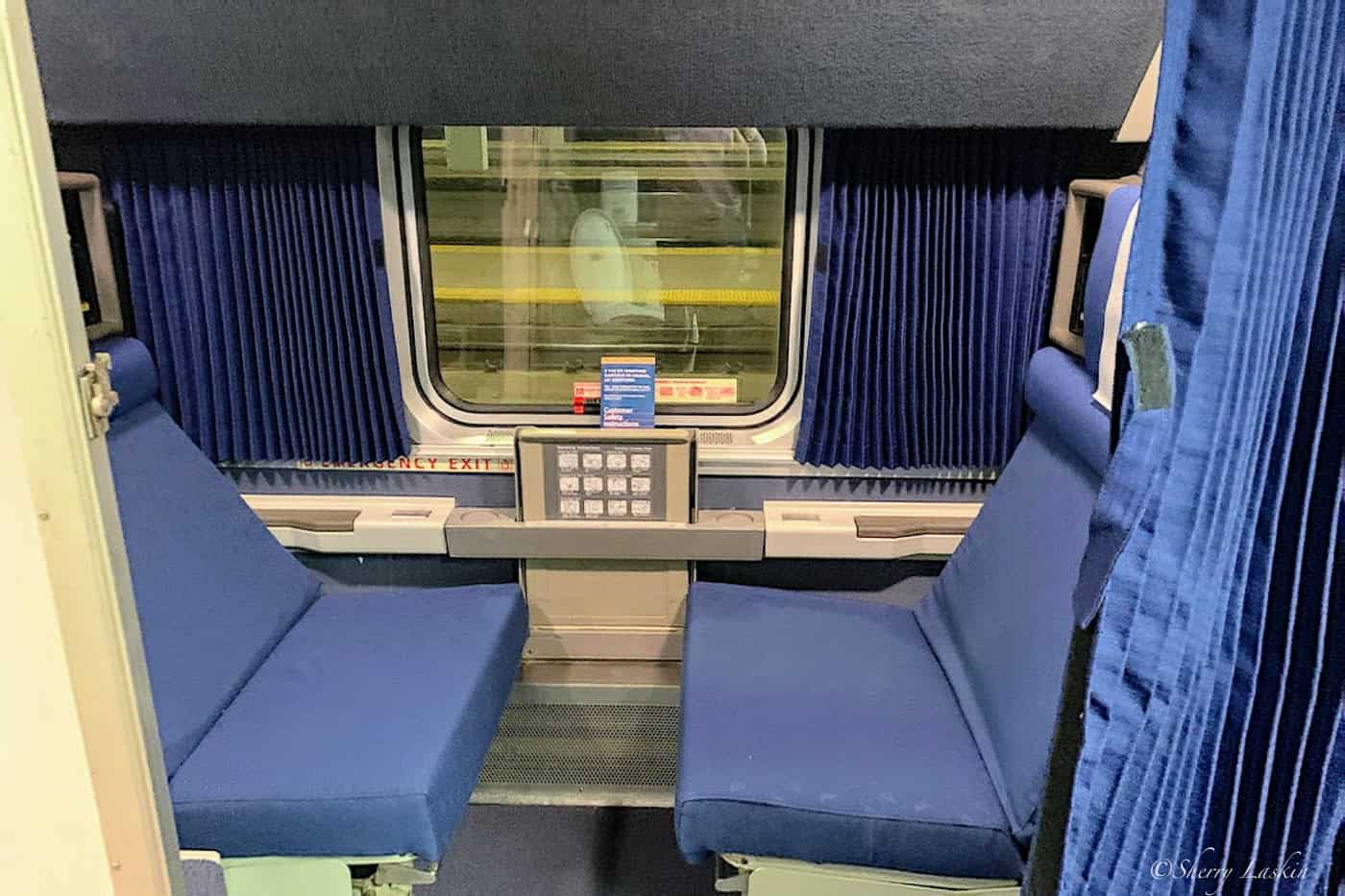 Amtrak roomette with two seats facing each other for daytime use.