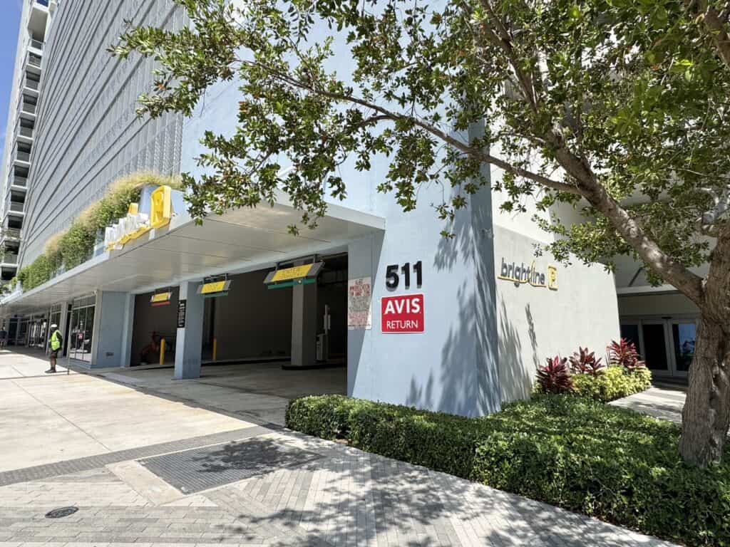 Outside view of West Palm Beach Brightline station and parking structure entrance .